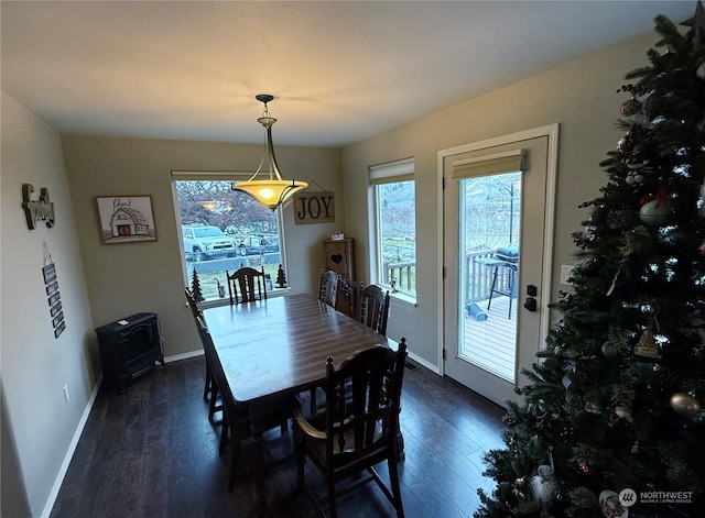 dining room with dark wood-type flooring