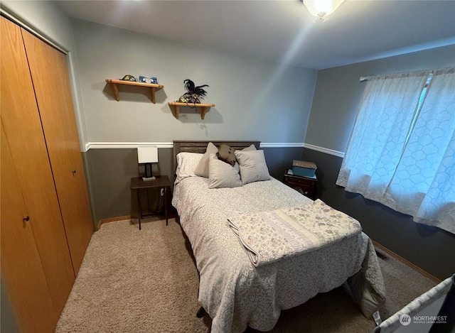 carpeted bedroom featuring a closet