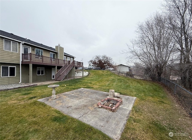 view of yard featuring a patio area and a deck