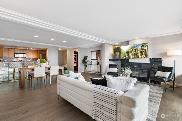 living room with crown molding and dark wood-type flooring