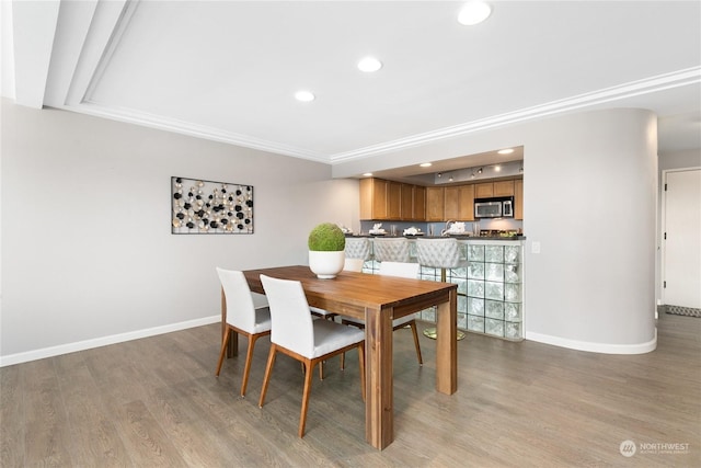 dining area featuring light wood-type flooring