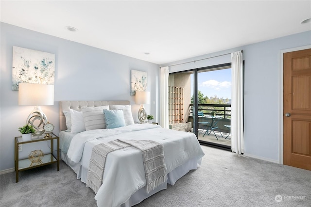 carpeted bedroom featuring access to outside