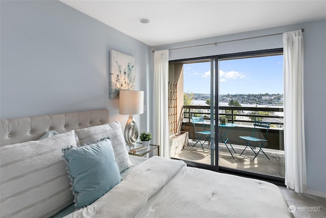 carpeted bedroom featuring access to exterior