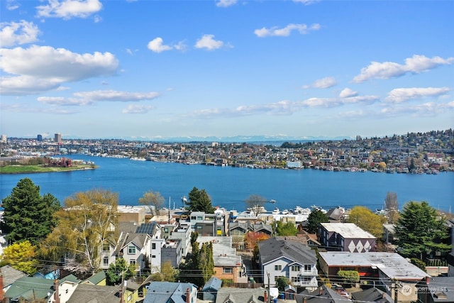 birds eye view of property with a water view