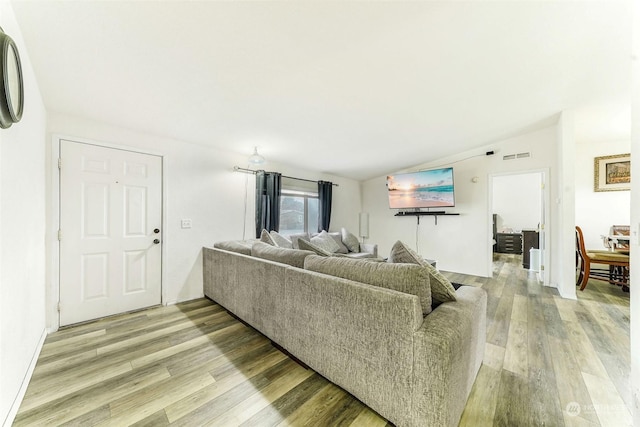 living room with light hardwood / wood-style floors