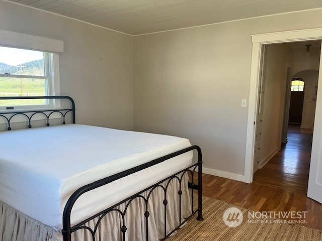 bedroom with wood-type flooring