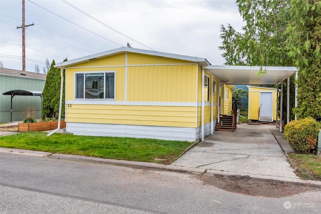 225 NE Ernst St Unit 26, Oak Harbor, WA 98277 - view of home's exterior featuring a carport