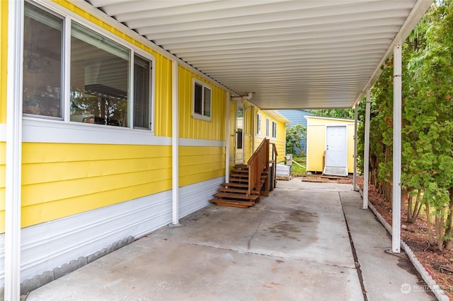 view of patio with a storage unit