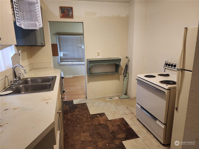 kitchen with white appliances and sink