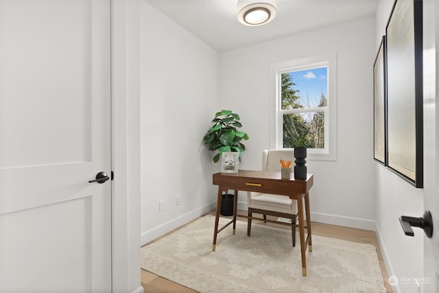 office featuring light wood finished floors and baseboards