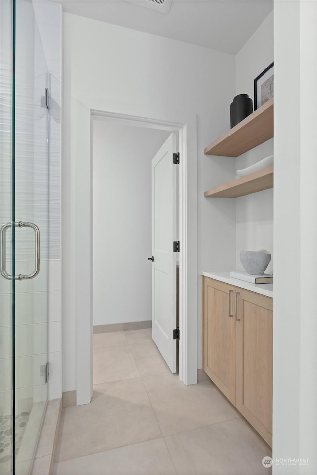 hallway featuring light tile patterned flooring