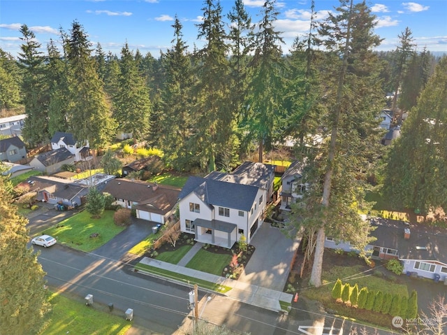 birds eye view of property with a residential view