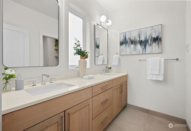 bathroom featuring vanity, tile patterned floors, and plenty of natural light