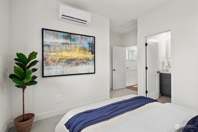 carpeted bedroom featuring a wall mounted air conditioner and connected bathroom