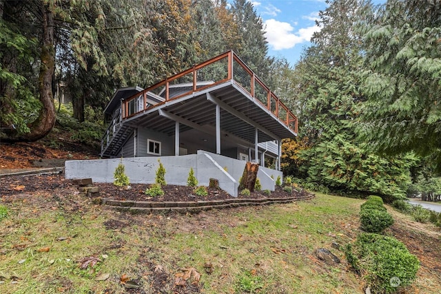 view of property exterior with a wooden deck