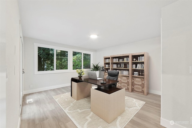 office space featuring light wood-type flooring