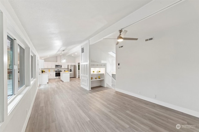 unfurnished living room featuring a textured ceiling, light hardwood / wood-style floors, ceiling fan, and lofted ceiling