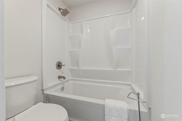 bathroom with shower / bathtub combination and toilet