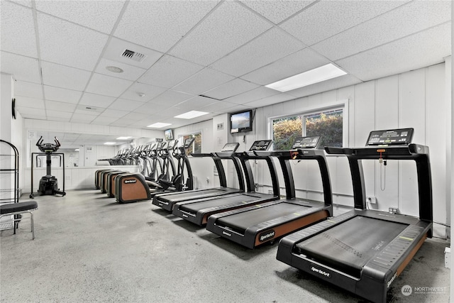 exercise room with a paneled ceiling