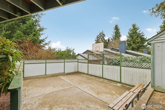 view of patio / terrace with fence and basketball court