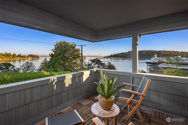 balcony featuring a water view