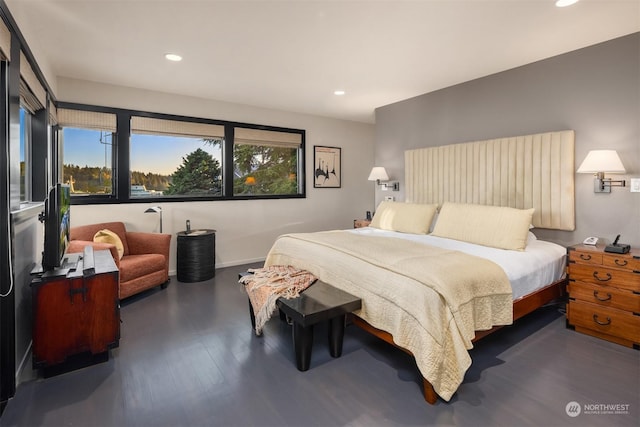 bedroom featuring baseboards, dark wood-type flooring, and recessed lighting