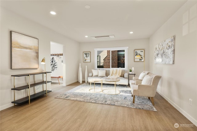 living room with light hardwood / wood-style flooring