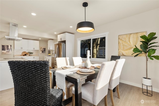 dining room featuring light hardwood / wood-style flooring