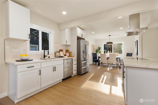 kitchen with sink, white cabinets, and appliances with stainless steel finishes