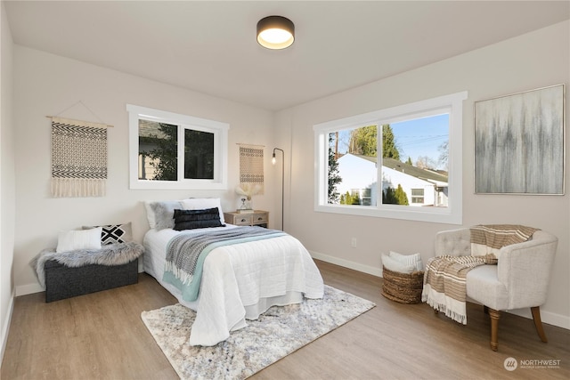 bedroom with wood-type flooring