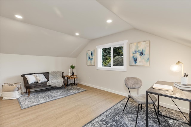 office area featuring wood-type flooring and vaulted ceiling