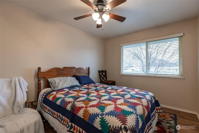 bedroom with ceiling fan and wood-type flooring