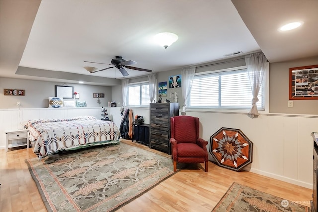 bedroom with ceiling fan and hardwood / wood-style floors