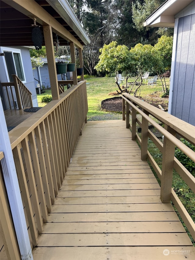 wooden terrace with a yard