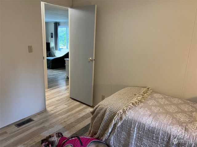 bedroom with light wood-type flooring