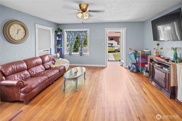 423 3rd Ave NE, Soap Lake, WA 98851 - living room featuring a ceiling fan and wood finished floors