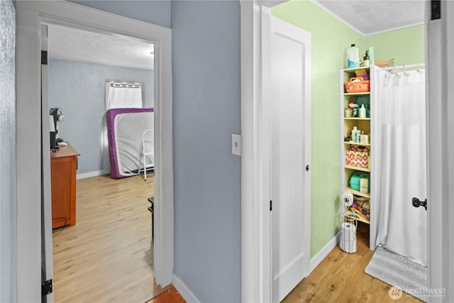 423 3rd Ave NE, Soap Lake, WA 98851 - hallway featuring light wood-type flooring and baseboards