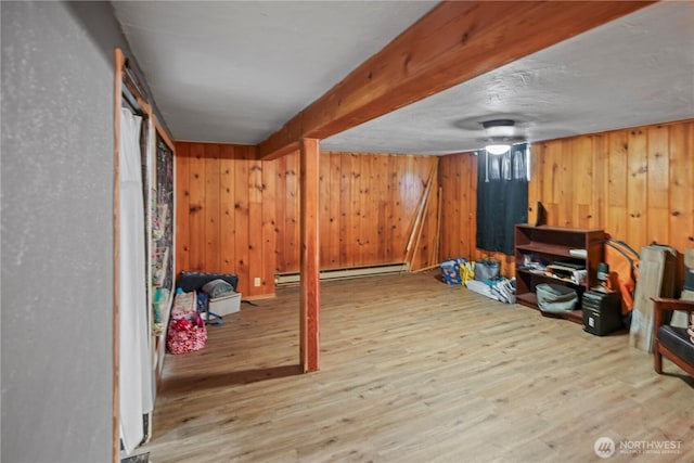 423 3rd Ave NE, Soap Lake, WA 98851 - workout room with baseboard heating, wood finished floors, and wooden walls
