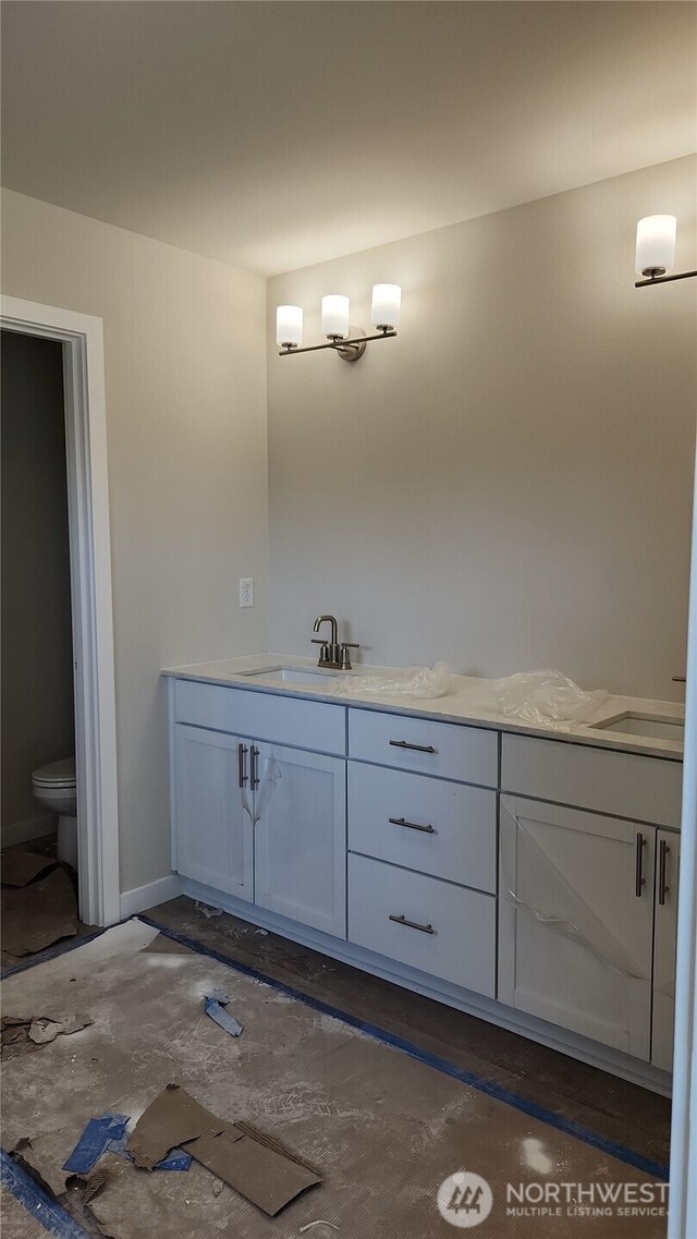 bathroom with vanity and toilet