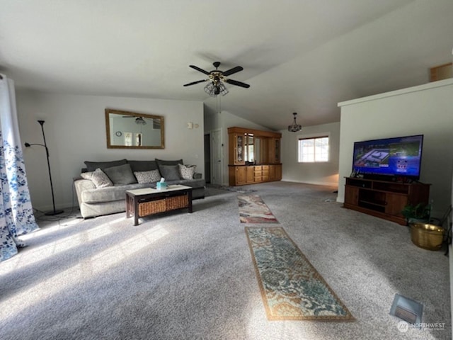 carpeted living room featuring vaulted ceiling and ceiling fan