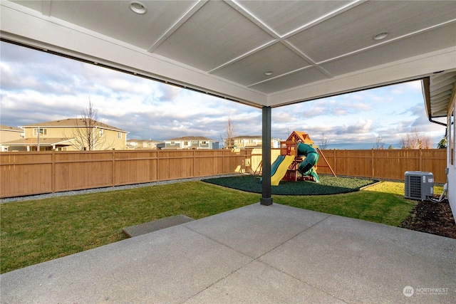 view of patio / terrace featuring central air condition unit and a playground