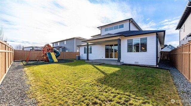 back of house with a yard, a playground, a patio, and central AC unit