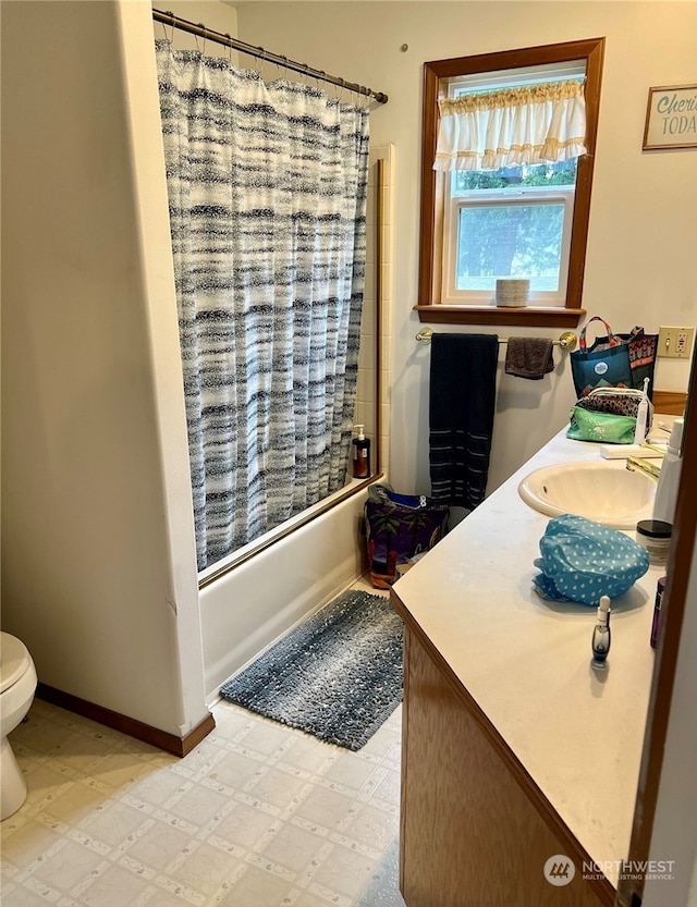 full bathroom with toilet, vanity, and shower / tub combo with curtain