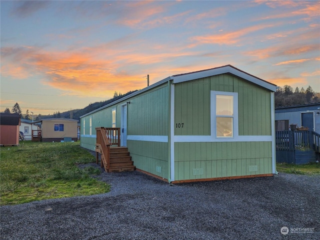 view of property exterior at dusk