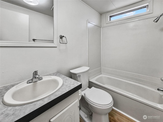 full bathroom with shower / bathing tub combination, vanity, toilet, and hardwood / wood-style floors