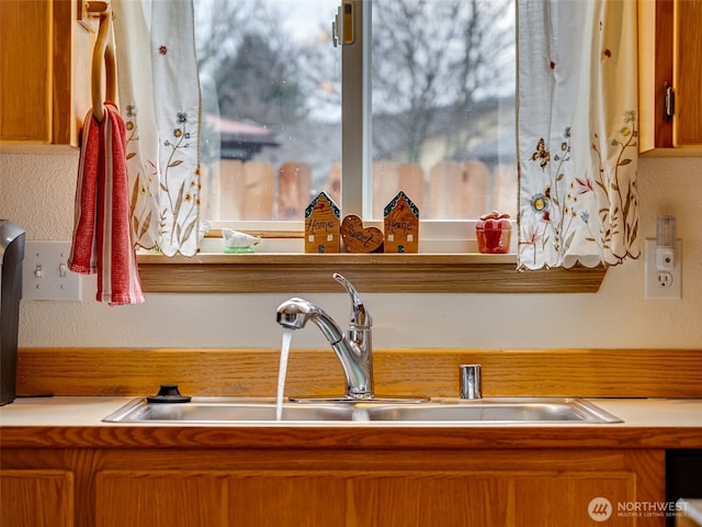 interior details featuring a sink