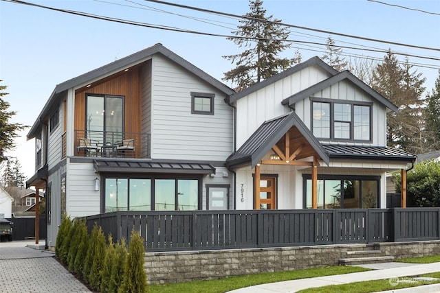 rear view of property featuring a porch