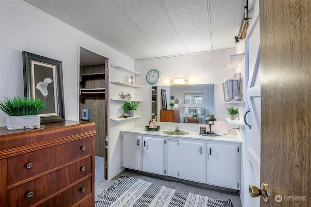 bathroom featuring vanity and a textured ceiling