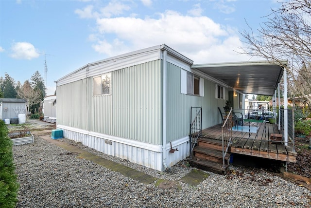 view of side of home featuring a deck