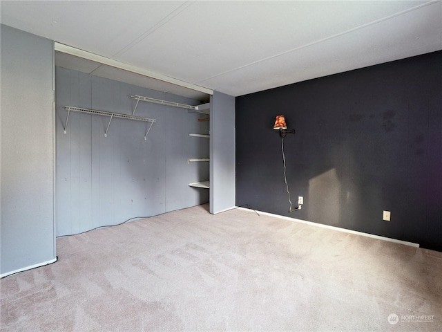 unfurnished bedroom featuring light colored carpet